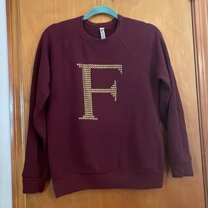 Harry Potter themed cranberry pullover with gold F for Fred Weasley